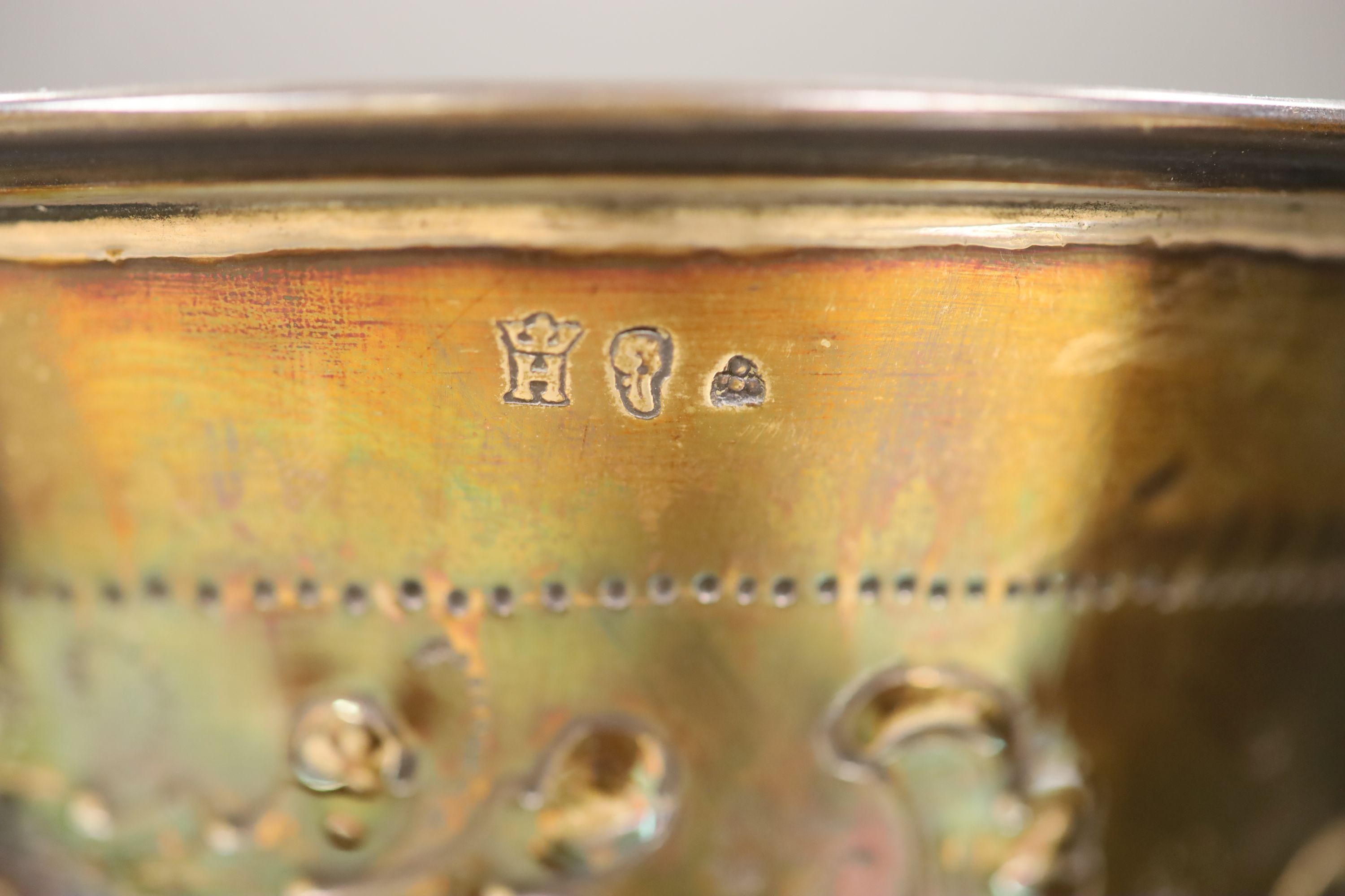 A late 19th century Hanau embossed white metal vase with, London 1897 import mark, decorated with birds and flowers,